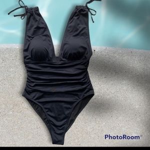 NWOT Low Cut Roched Black Tank One Piece Swimsuit. New in manufacturing bag